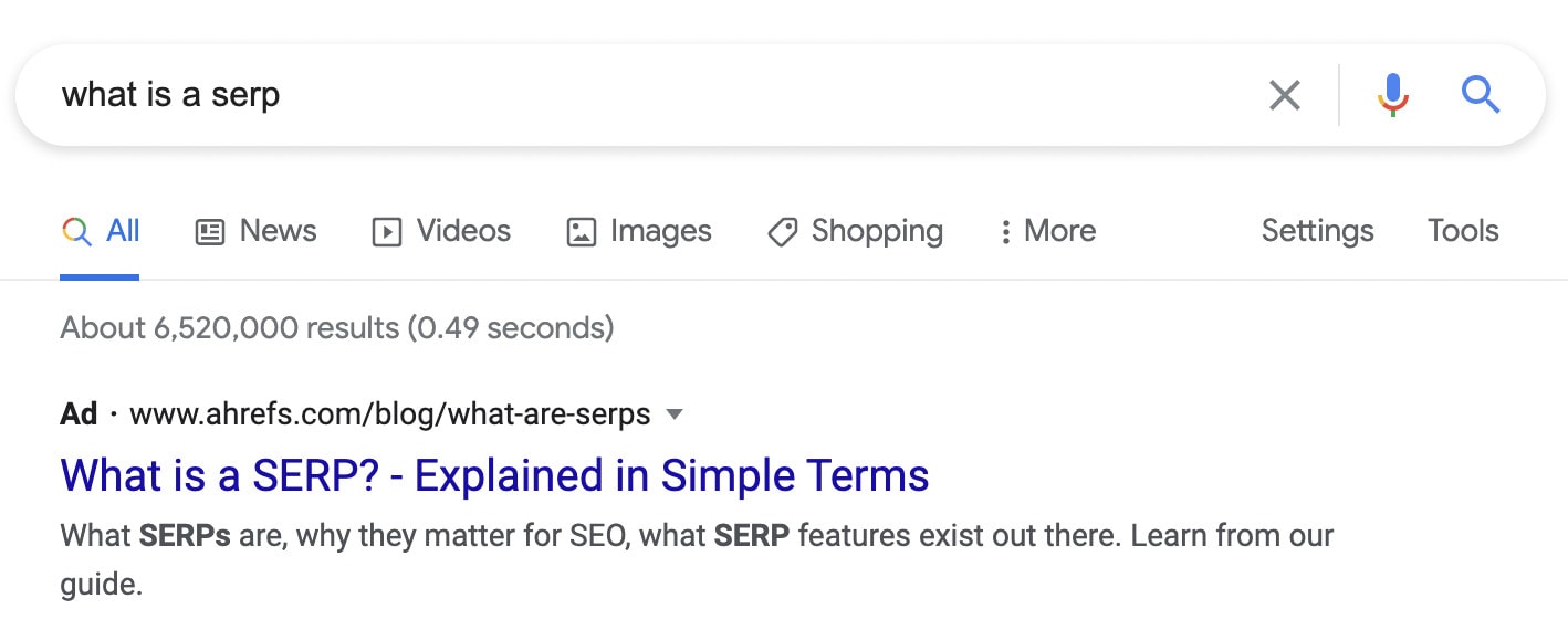 A pay-per-click ad on the SERP for the search term "what is a SERP?"